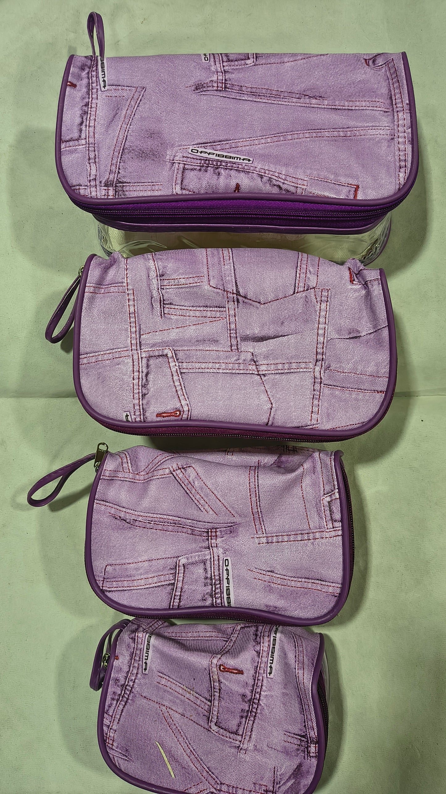 Purple denim print travel pouches in 4 sizes
