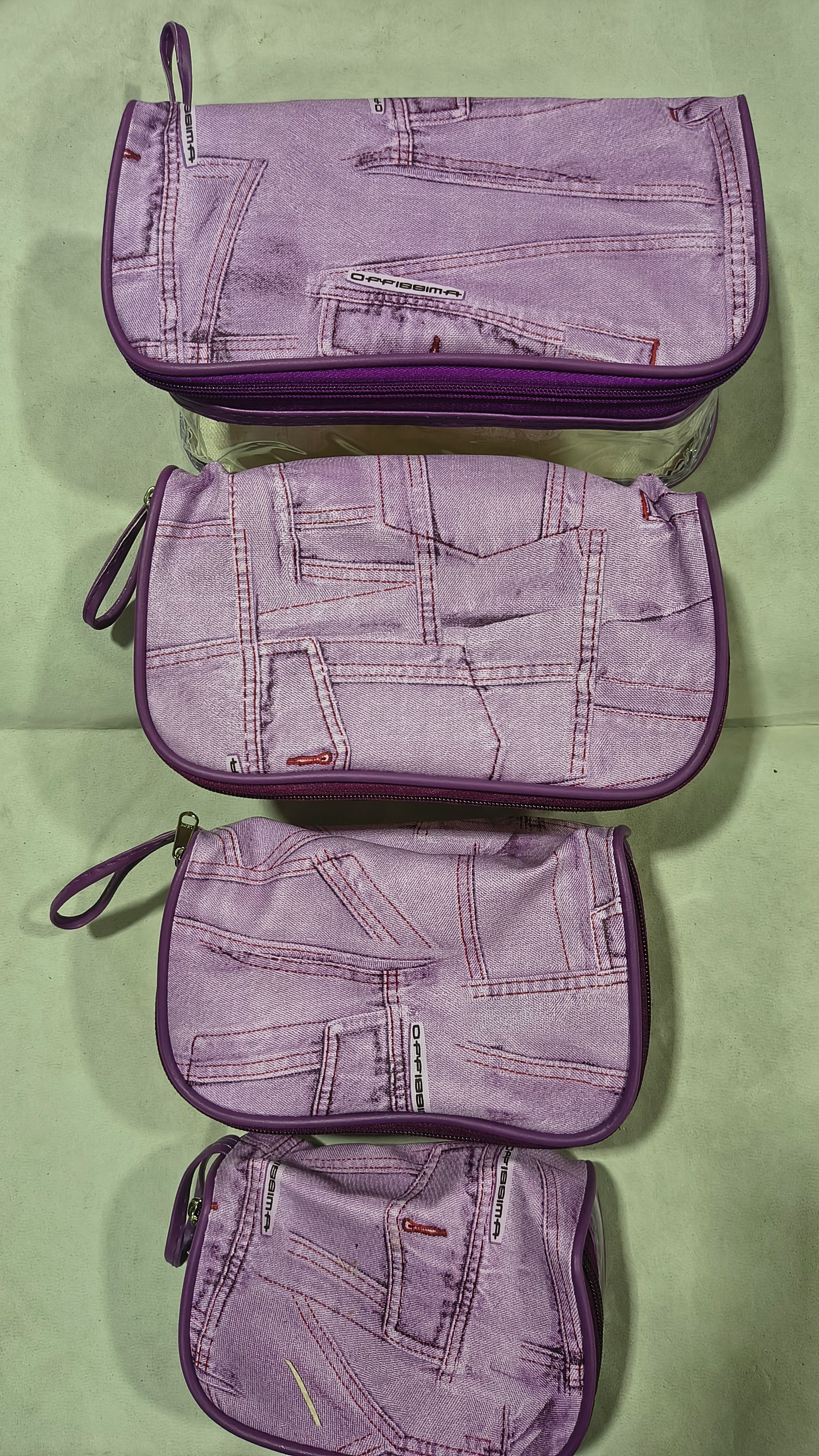 Purple denim print travel pouches in 4 sizes