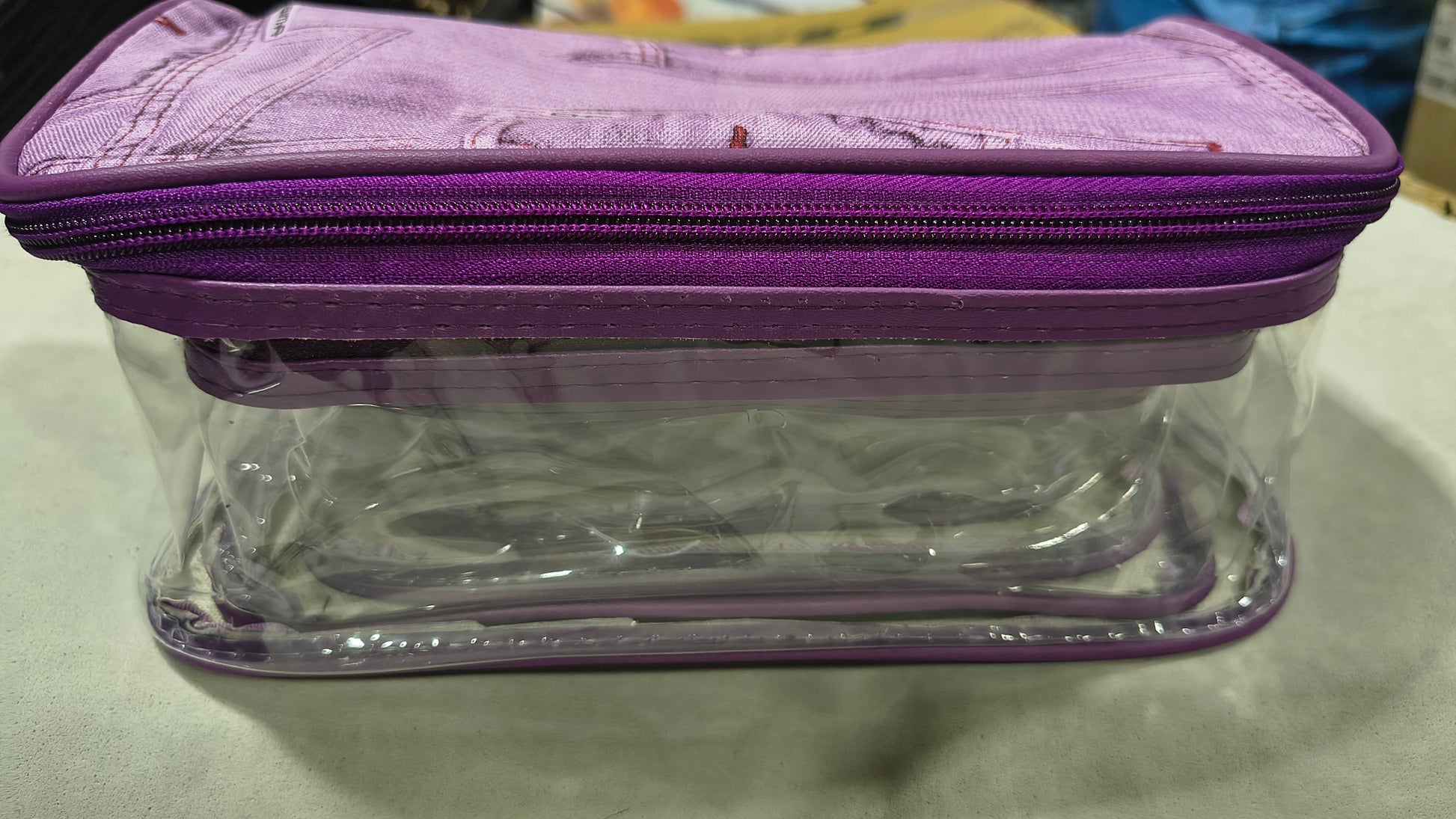 Clear cosmetic organizer box with purple denim print fabric lid